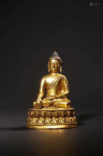 AN IMPERIAL  GILT-BRONZE FIGURE OF BUDDHA SHAKYAMUNI,QIANLON...