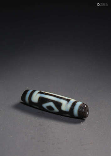 A TWO-EYED DZI BEAD