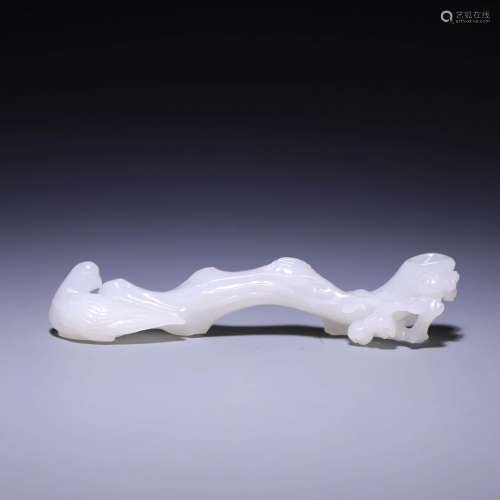 A CARVED WHITE JADE BRUSH REST,QING DYNASTY