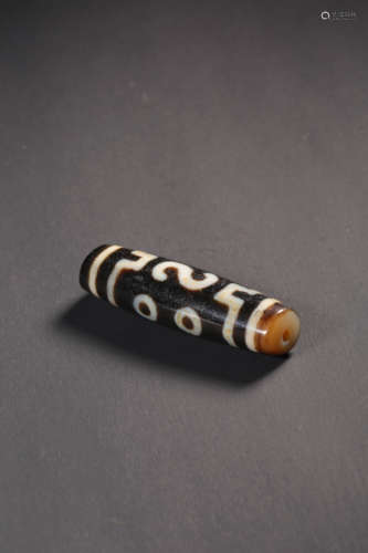 A FOUR-EYED DZI BEAD