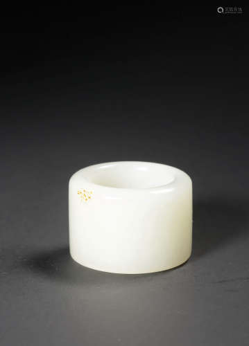 A WHITE AND RUSSET JADE ARCHER'S RING,,QING DYNASTY