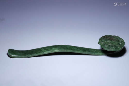 A CARVED SPINACH-GREEN JADE RUYI SCEPTER,QING DYNASTY