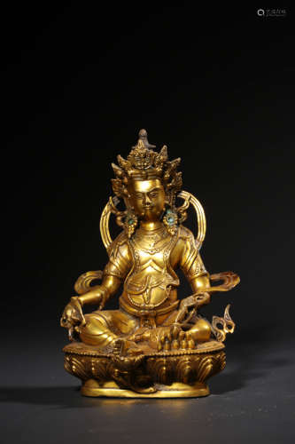 A  GILT-BRONZE FIGURE OF JAMBHALA,QING DYNASTY