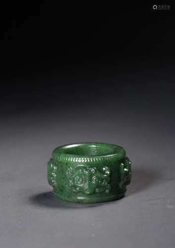 A SPINACH-GREEN JADE‘BEAST’ARCHER'S RING,QING DYNASTY