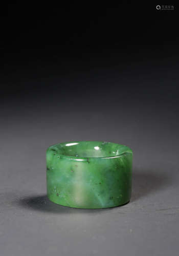 A SPINACH-GREEN JADE ARCHER'S RING,QING DYNASTY