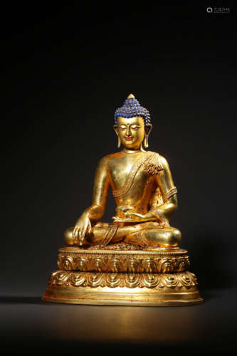 AN IMPERIAL  GILT-BRONZE FIGURE OF BUDDHA SHAKYAMUNI,QIANLON...