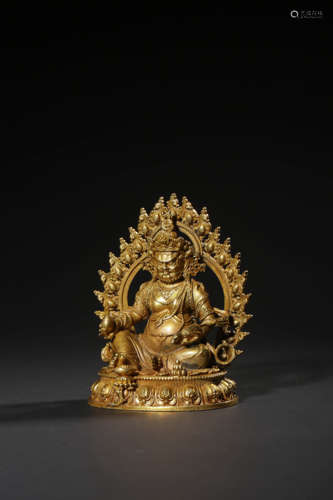 A  GILT-BRONZE FIGURE OF JAMBHALA,QING DYNASTY