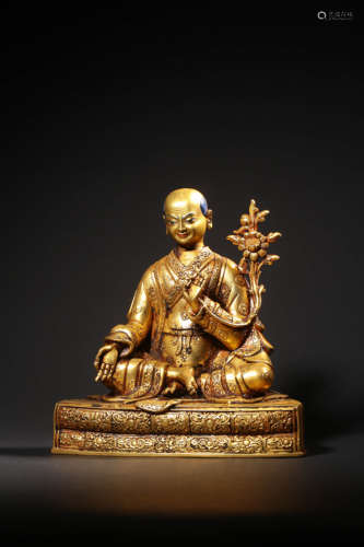 A GILT-BRONZE FIGURE OF GURU,QING DYNASTY