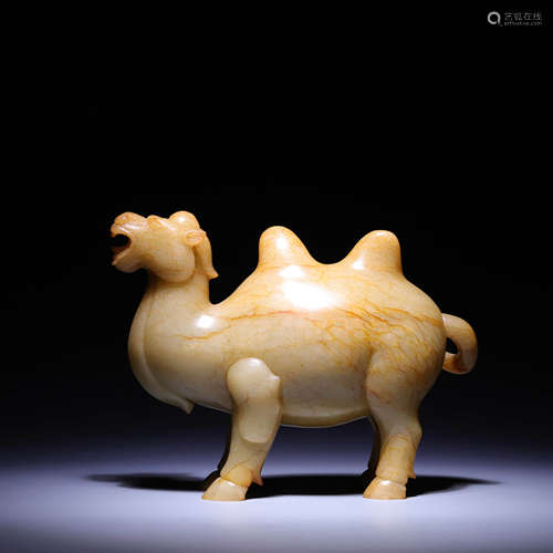 A CARVED WHITE AND RUSSET JADE CAMEL,QING DYNASTY