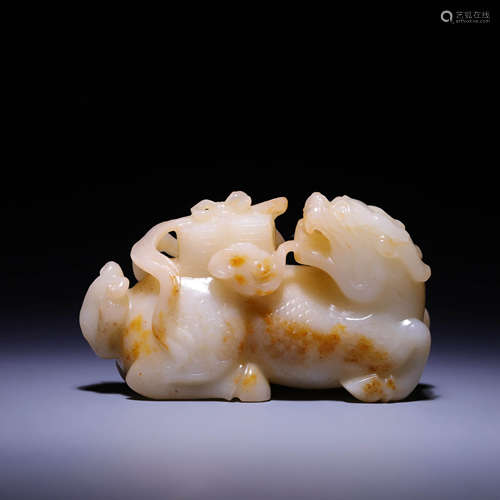 A CARVED WHITE JADE QILIN,QING DYNASTY