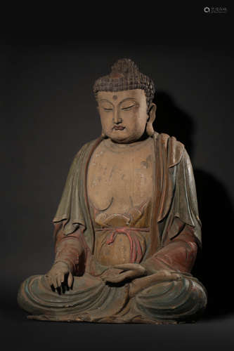 A POLYCHROME WOOD FIGURE OF SAKYAMUNI