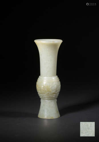 A CARVED WHITE JADE BEAKER VASE,QIANLONG PERIOD