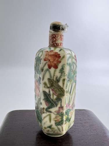 A hexagonal shape famille rose snuff bottle with a scene of ...