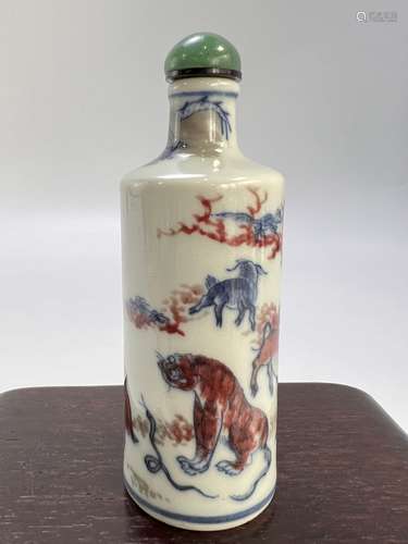 A twelve animals depicted underglaze red and blue&white snuf...