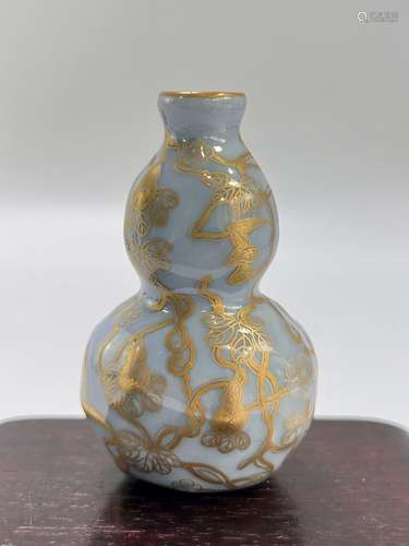 A blue ground gilt snuff bottle, Qing Dynasty Pr.