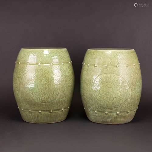 A PAIR OF CARVED LONGQUAN CELADON BARREL-FORM STOOLS