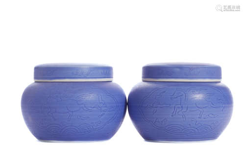 Pair of Ming blue carved covered jars