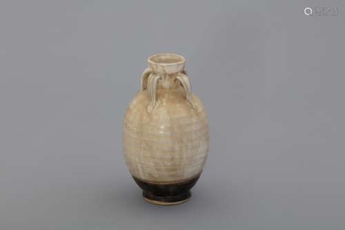 Jin Dynasty white glazed vase with four handles