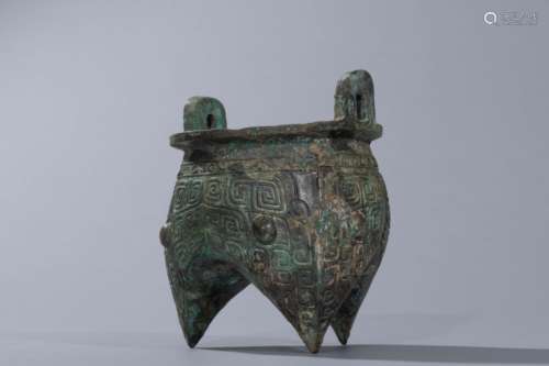 Chinese Shang Period bronze tripot-censer with masks design