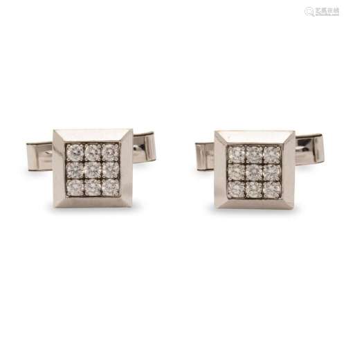 A pair of diamond and eighteen karat white gold cufflinks