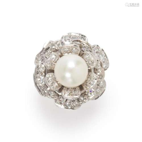 A pearl, diamond and fourteen karat white gold ring