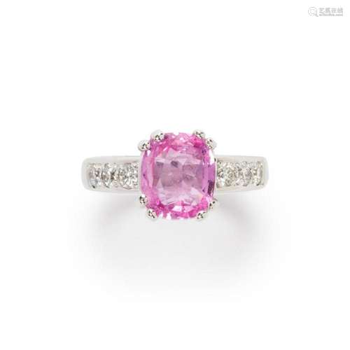 A pink sapphire, diamond and eighteen karat white gold ring