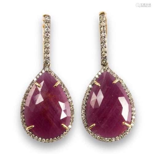 A pair of ruby and diamond earrings