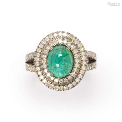 An emerald and diamond ring