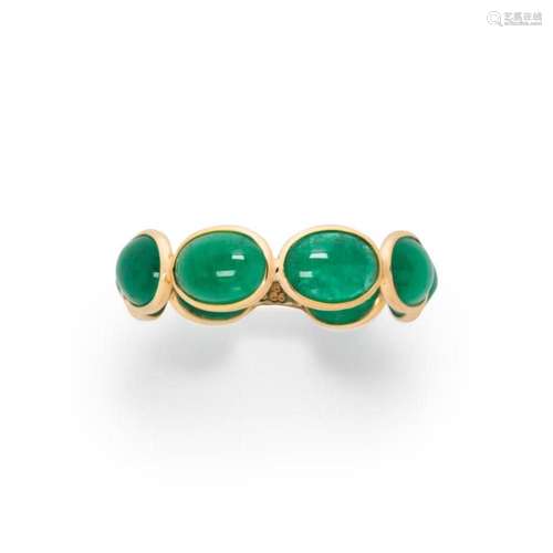 An emerald and eighteen karat gold ring