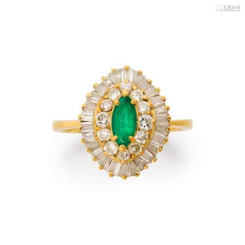 An emerald, diamond and eighteen karat gold ring