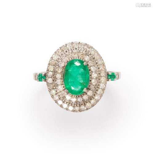 An emerald and diamond ring