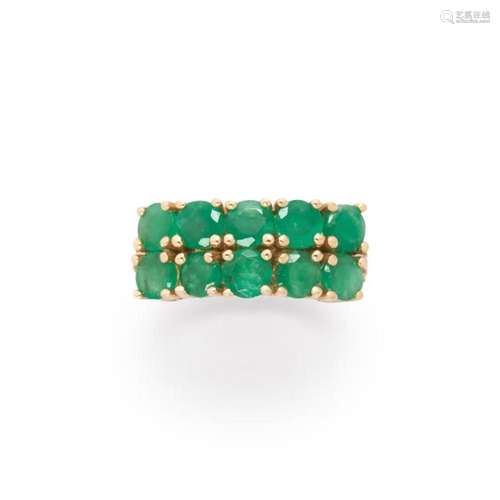 An emerald and ten karat gold ring