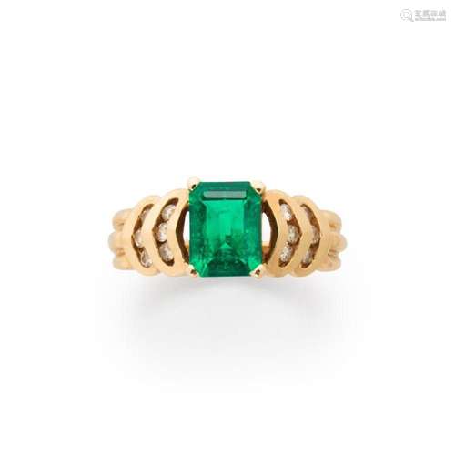 A synthetic emerald, diamond and fourteen karat gold ring