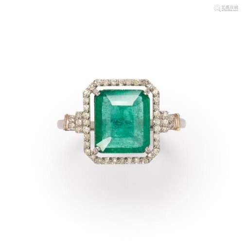 An emerald and diamond ring