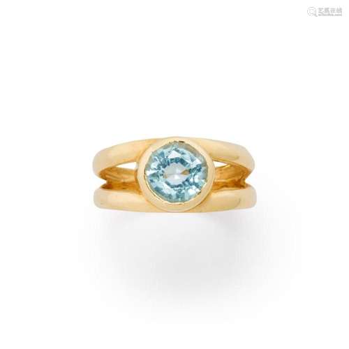 A blue topaz and fourteen karat gold ring