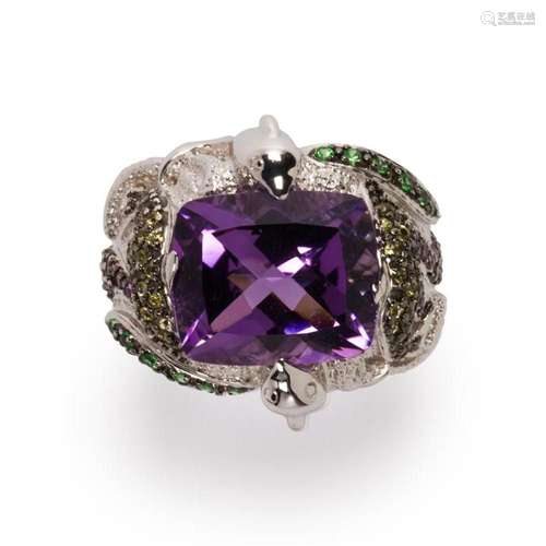 A gemstone and eighteen karat white gold ring