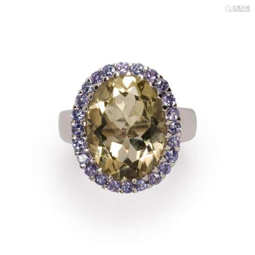 A citrine, tanzanite and fourteen karat white gold ring