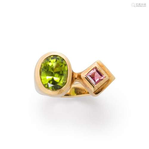 A peridot, pink beryl and fourteen karat gold ring