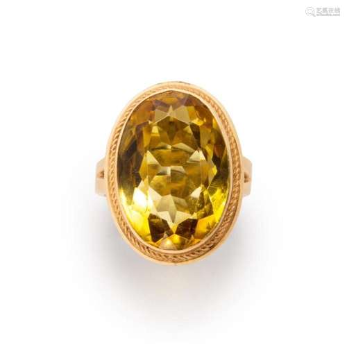 A citrine and fourteen karat gold ring