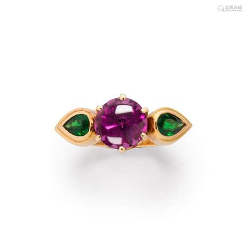 A gemstone and fourteen karat gold ring