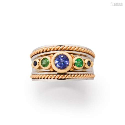 A gemstone and fourteen karat white bi-color gold ring