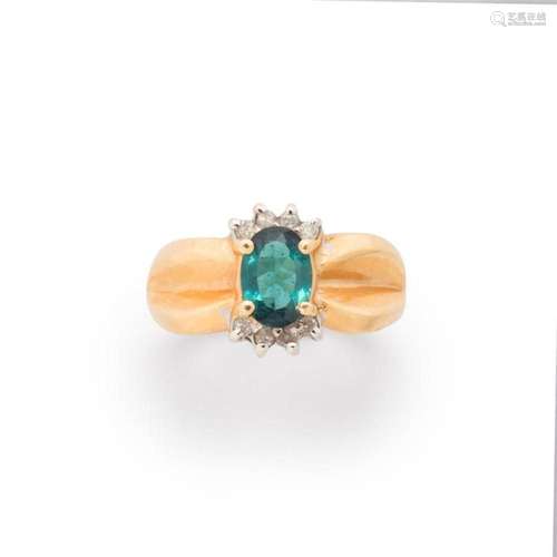 A bluish green beryl, diamond and fourteen karat gold ring