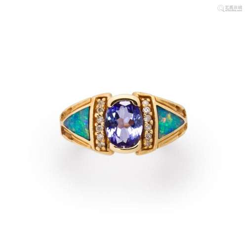 A gemstone and fourteen karat gold ring