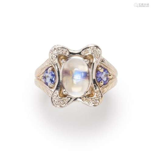 A gemstone and fourteen karat white gold ring