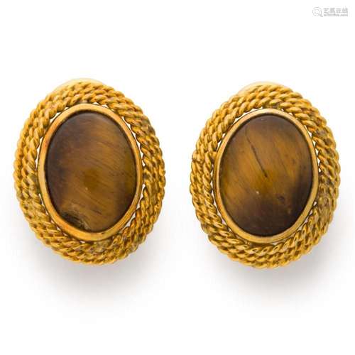 A pair of tiger s eye and fourteen karat gold earrings