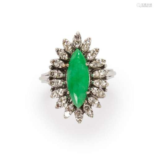 A jade, diamond and fourteen karat white gold ring