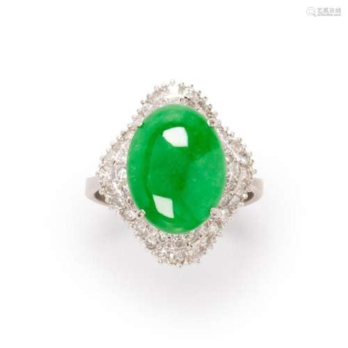 A jadeite, diamond and fourteen karat white gold ring