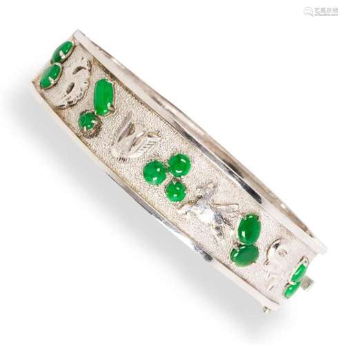 A jadeite and eighteen karat white gold bracelet