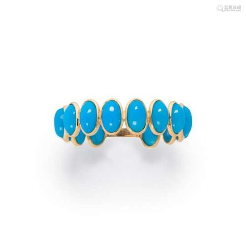 A turquoise and eighteen karat gold ring