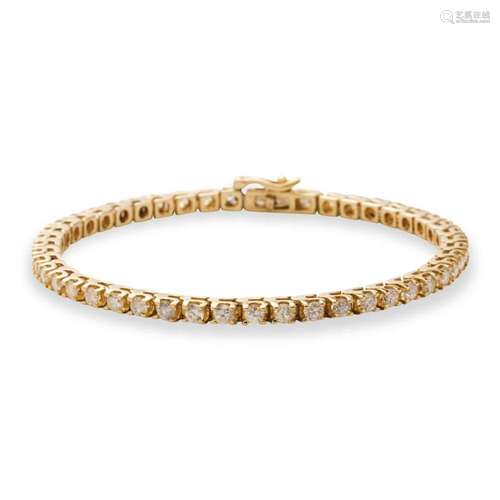 A diamond and fourteen karat gold bracelet